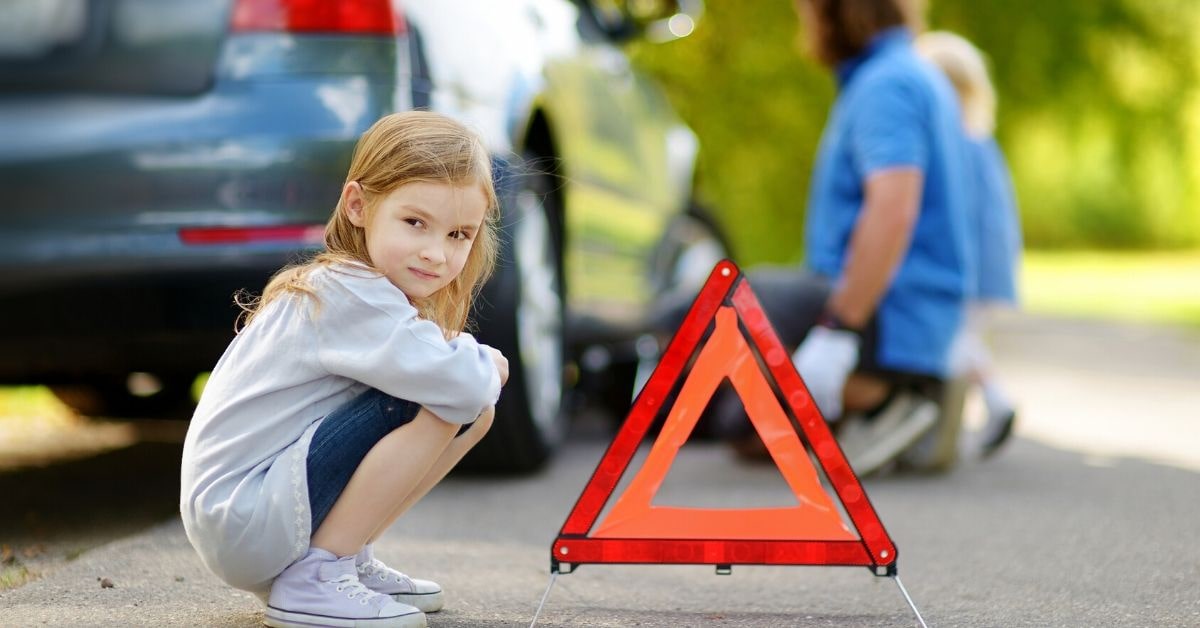 Little girl with roadside emergency equipment - Sierra Blanca Motors