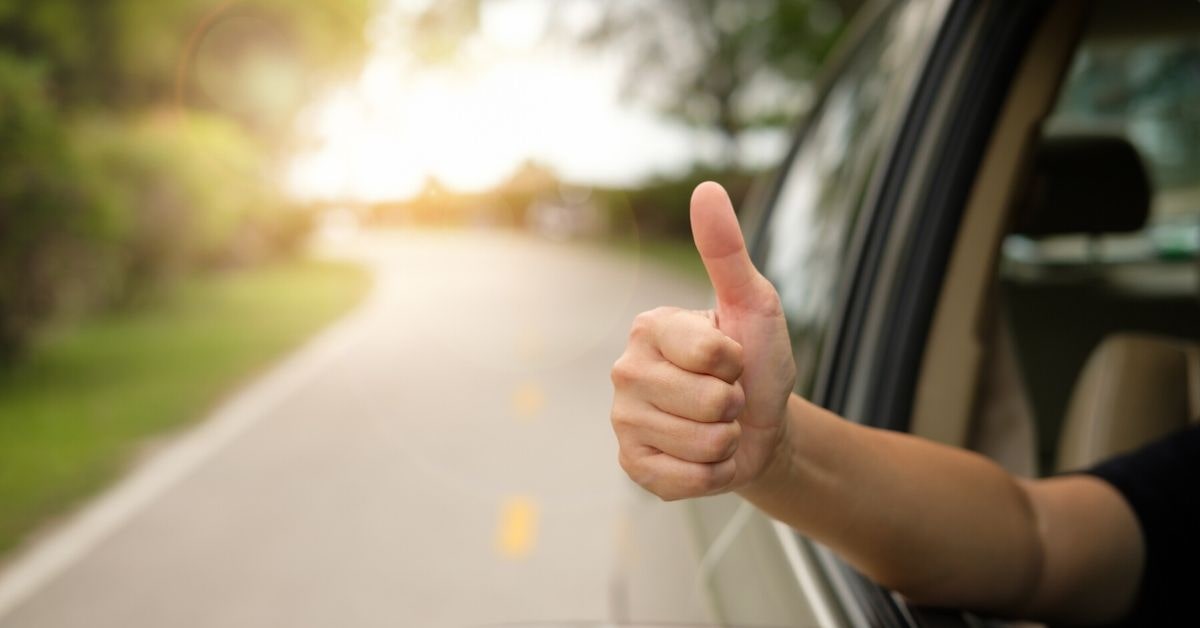 Thumbs up out of car window- Sierra Blanca Motors