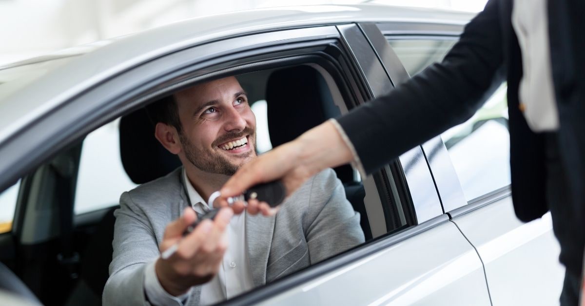 Happy Customer at Car Dealership - Sierra Blanca Motors