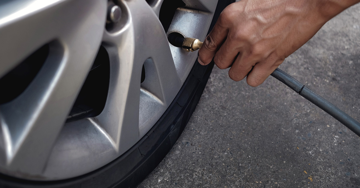 Filling car tire with air - Sierra Blanca Motors