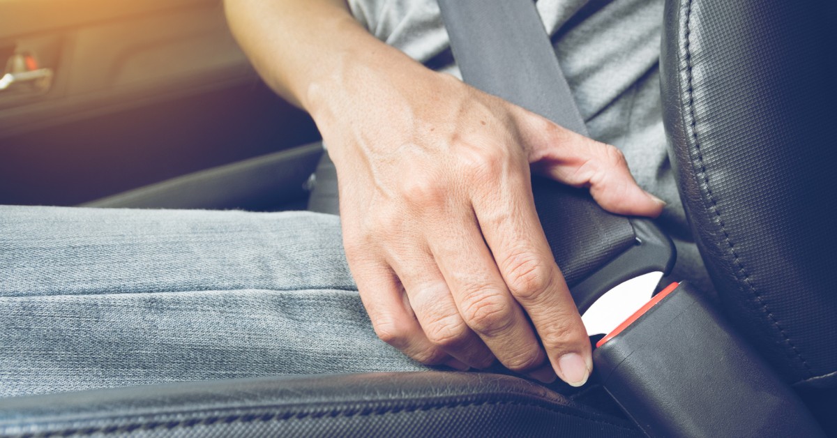 Person Buckling Their Seat Belt | Safe Vehicles | Sierra Blanca Motors