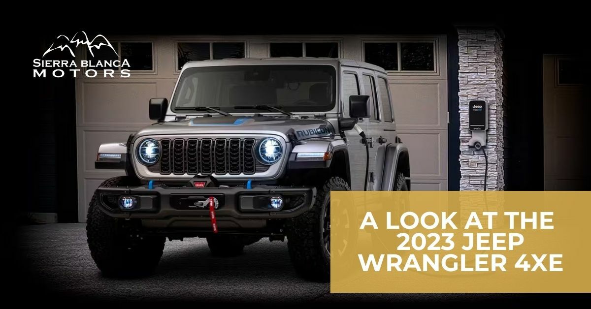 2023 Jeep Wrangler 4xe Plugged in Charging in A Driveway in Front of a Garage | A Look at the 2023 Jeep Wrangler 4xe | Sierra Blanca Motors
